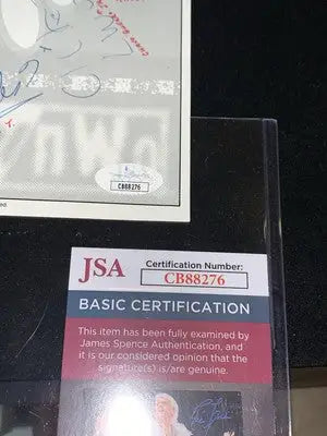 JSA certified autograph of Ric Flair and Arn Anderson on WWE NWO WCW signed flyer