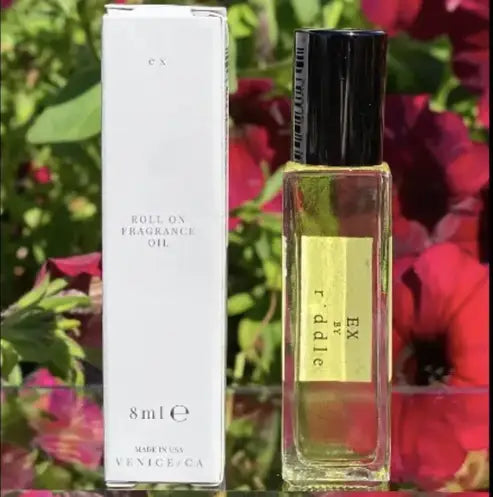 8ml Riddle Ex Roll-On Fragrance Oil in clear bottle with black cap and white packaging