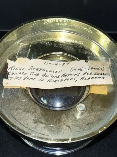 Vintage metal container with handwritten label for Riggs Stephenson Chicago Cubs memorabilia