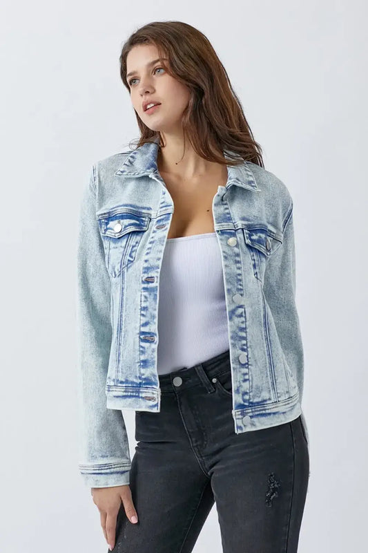 Light blue washed denim jacket with button closures and chest pockets for RISEN collection