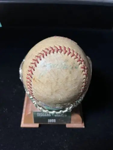 Worn baseball on ornate stand featuring Roger Maris autographs from Cleveland Indians