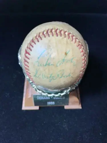 Autographed baseball on stand, featuring Roger Maris from Cleveland Indians 1955