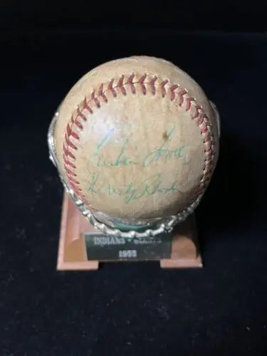 Autographed Roger Maris baseball on stand, featuring Cleveland Indians and NY Giants