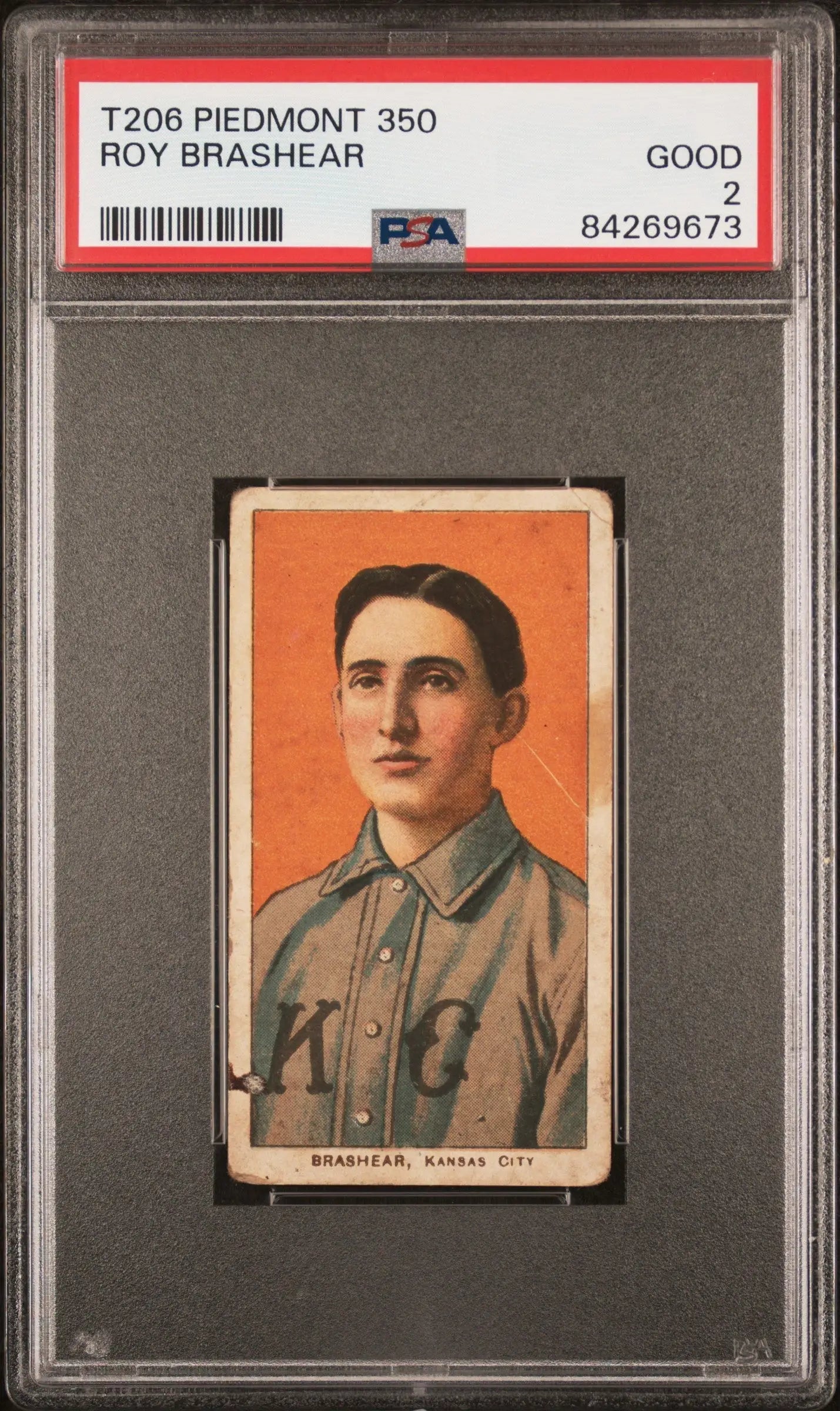 PSA-graded T206 Piedmont 350 trading card of Roy Brashear in gray uniform on orange background