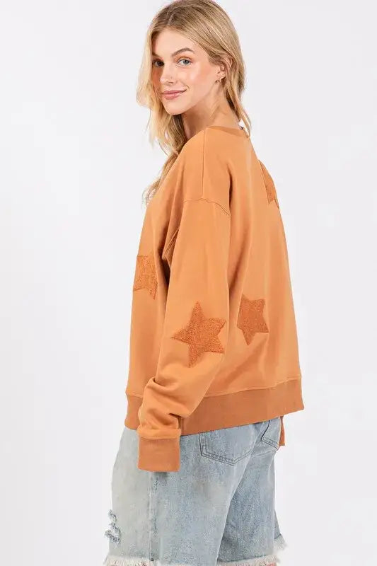 Mustard yellow star patch long sleeve sweatshirt with distressed denim shorts
