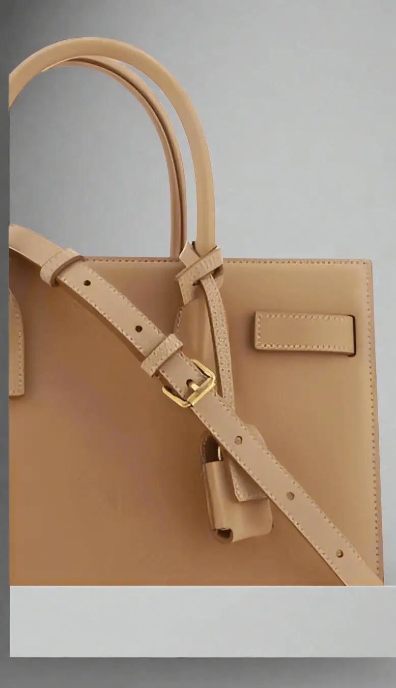 Saint Laurent brown leather handbag with top handle and adjustable shoulder strap