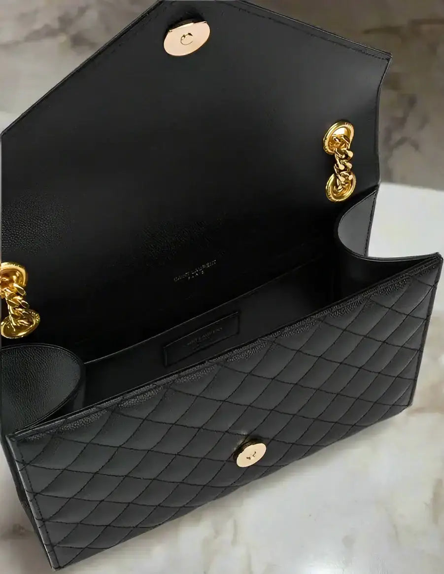 Open black quilted leather Saint Laurent Envelope Medium Bag with gold hardware and chain straps