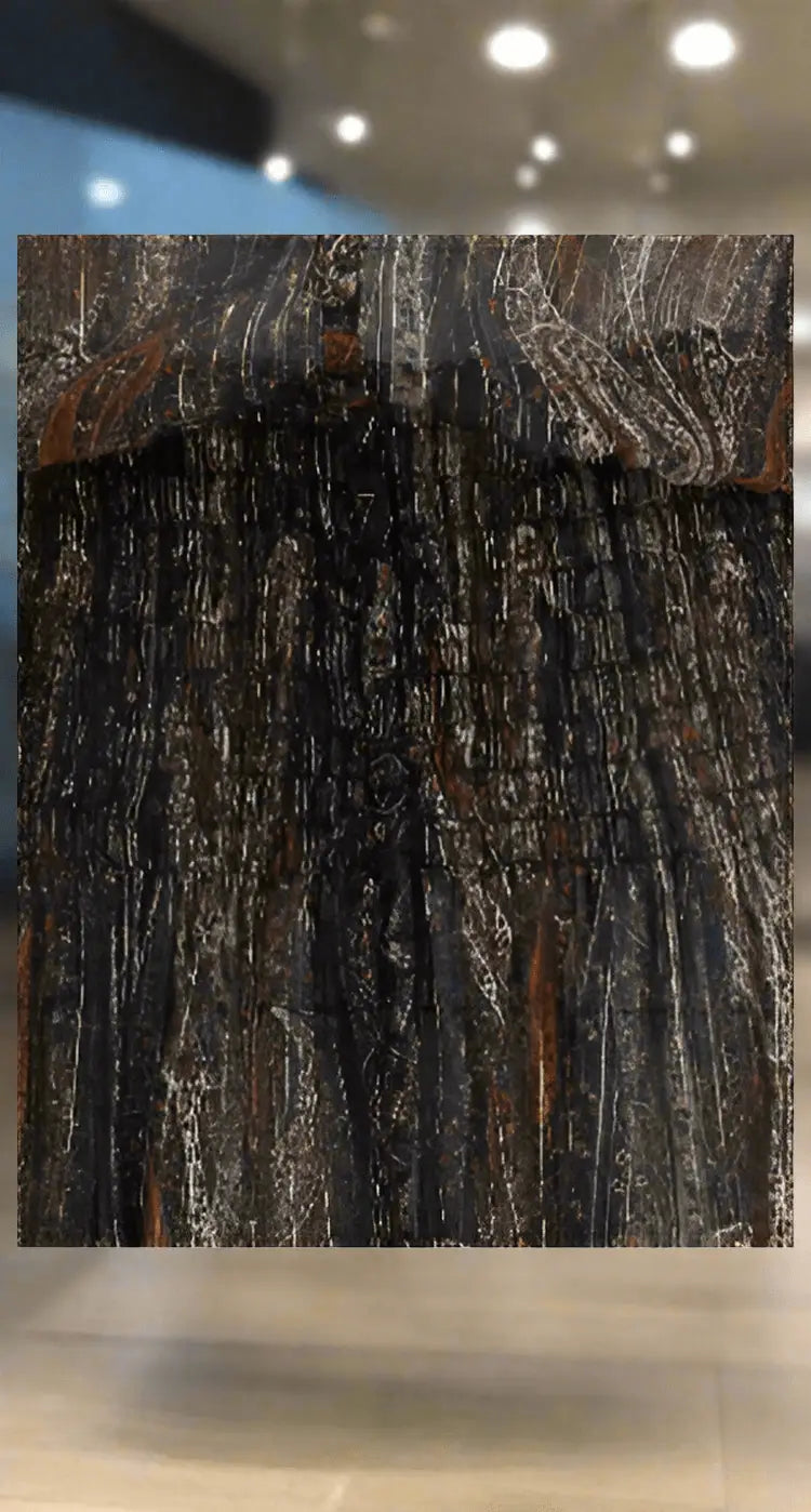 Dark textured wooden panel with shimmering silver and faint orange streaks for Saint Laurent Long Lavalliére Dress