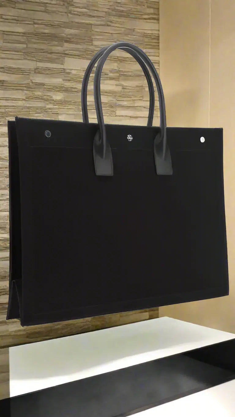 Black tote bag with dual top handles from Saint Laurent RIVE GAUCHE collection