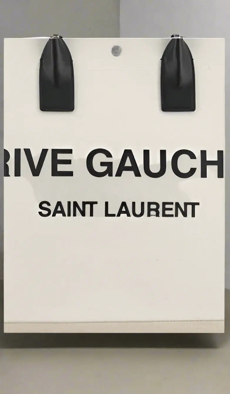 White shopping bag with black handles from Saint Laurent RIVE GAUCHE handbags collection