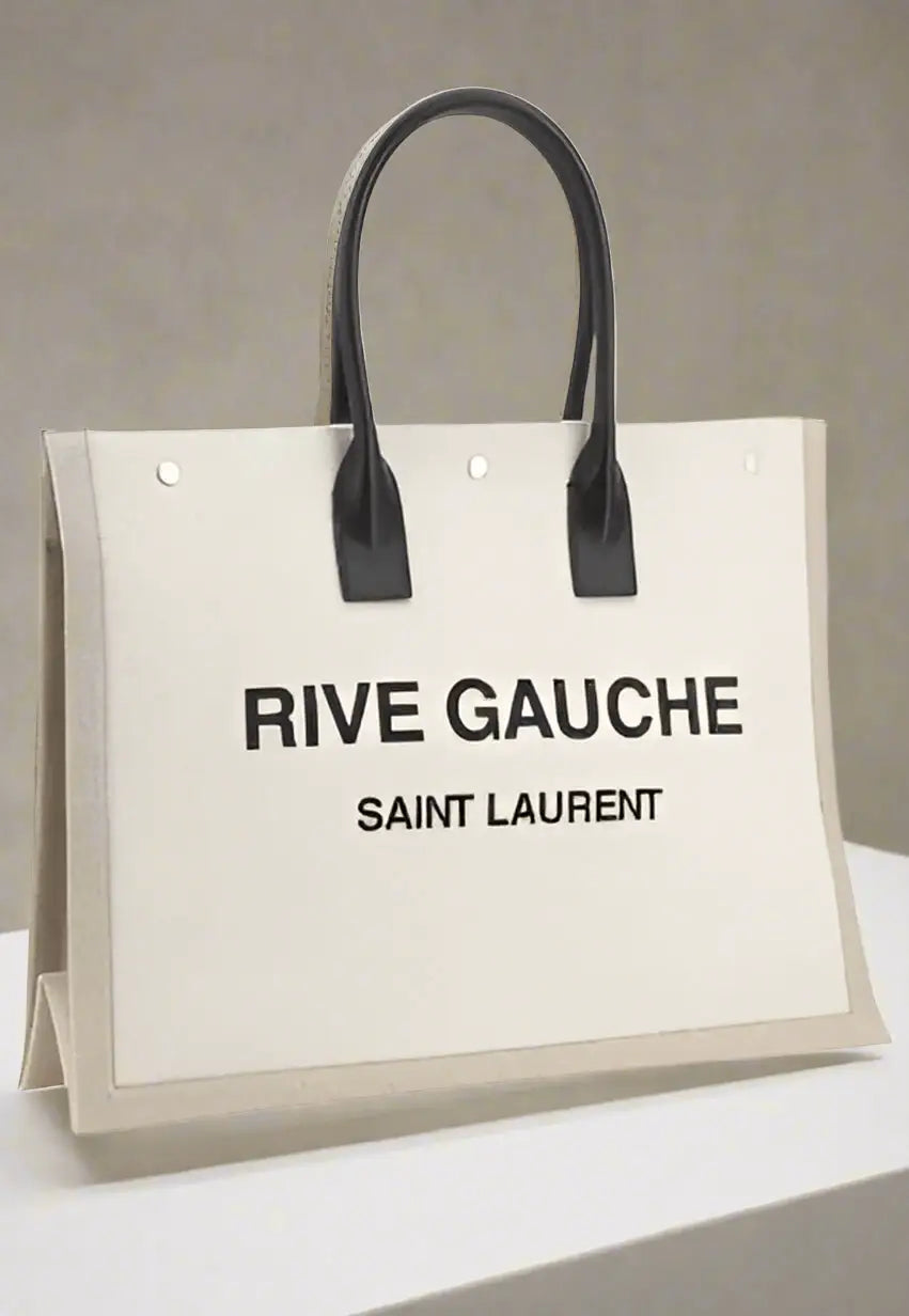 White canvas tote bag with black leather handles from Saint Laurent RIVE GAUCHE HANDBAGS