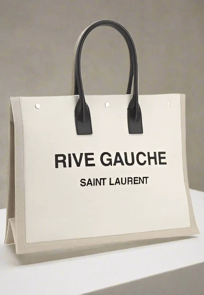 White canvas tote bag with black leather handles from Saint Laurent RIVE GAUCHE HANDBAGS