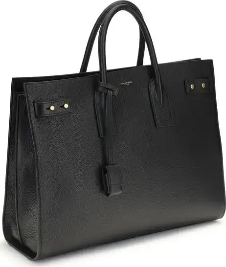 Saint Laurent Sac De Jour bag with black leather, top handles, and gold-tone hardware