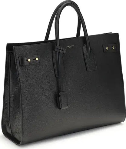 Saint Laurent Sac De Jour bag with black leather, top handles, and gold-tone hardware