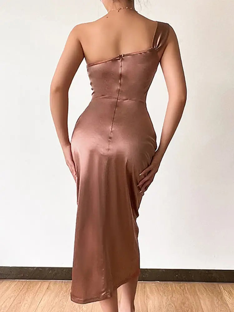 Woman in satin bodycon dress with one shoulder and side slit for stylish occasions