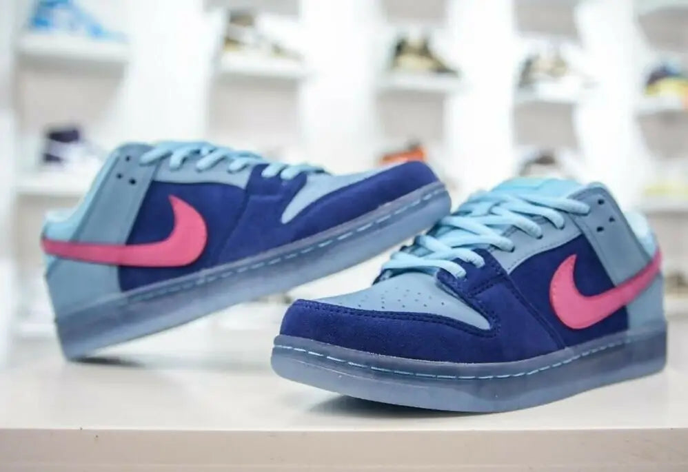 Blue Sb Dunk Low Run The Jewels sneakers with pink Nike Swooshes and light blue laces for fast shipping in business days
