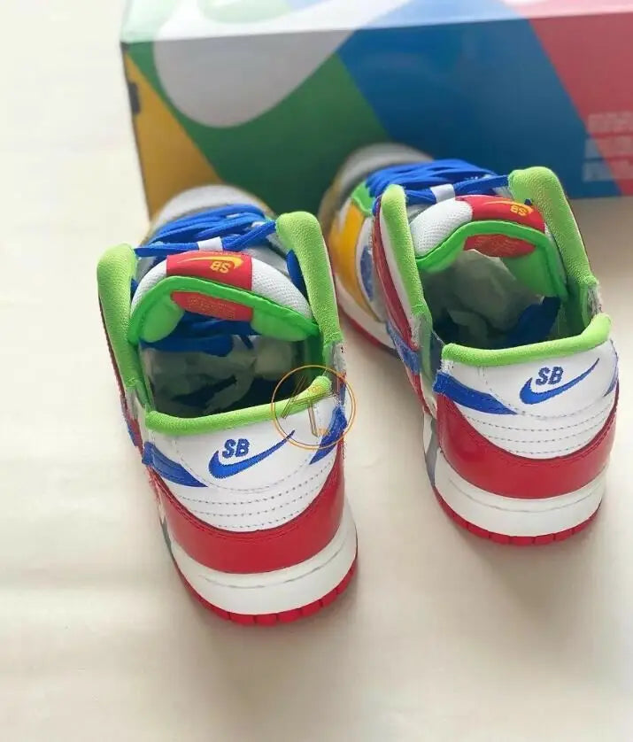 Colorful Nike SB Dunk Low Sandy Bodecker sneakers with red, white, blue, green, yellow accents, fast shipping