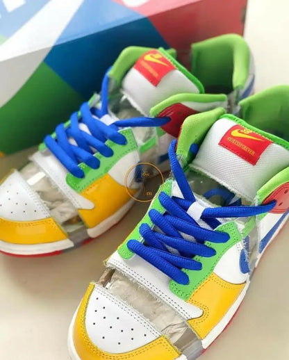 Colorful Nike SB Dunk Low Sandy Bodecker sneakers with clear plastic panels and blue laces, fast shipping