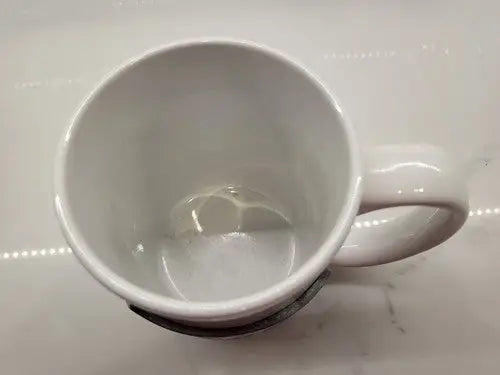 White ceramic coffee mug with Seattle Seahawks NFL football raised logo