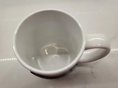 White ceramic coffee mug with Seattle Seahawks NFL football raised logo