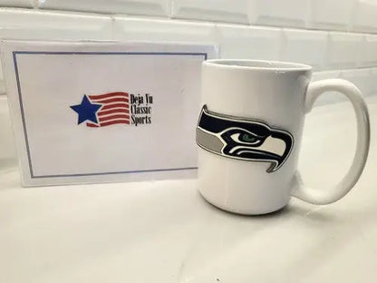White ceramic coffee mug featuring Seattle Seahawks logo for NFL fans