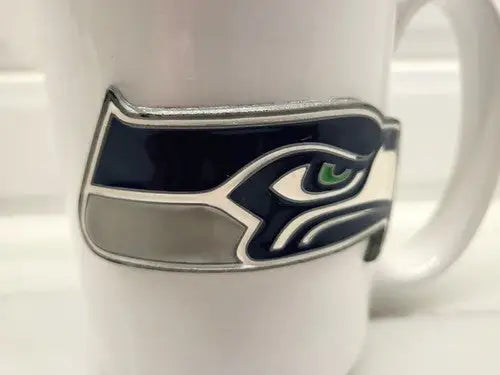 Seattle Seahawks ceramic coffee mug with raised NFL football logo design