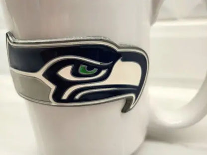 White ceramic coffee mug with Seattle Seahawks NFL raised logo for fans