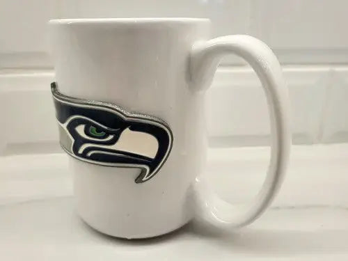 White ceramic coffee mug with Seattle Seahawks NFL logo perfect for fans
