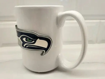 White ceramic coffee mug with Seattle Seahawks NFL logo perfect for fans