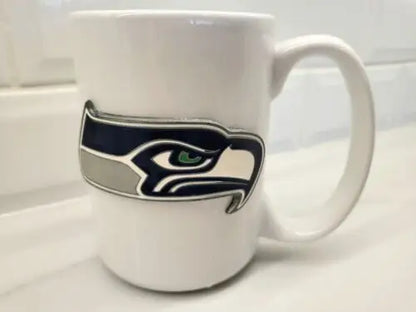 White ceramic coffee mug featuring Seattle Seahawks NFL logo perfect for fans
