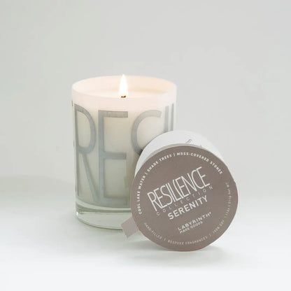 Serenity candle is filled in a beautiful custom glass vessel with the word - 60-hour burn - candle