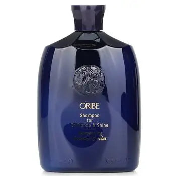 Dark blue Shampoo Bottle with Ornate Cap and Circular Emblem for Brilliance & Shine