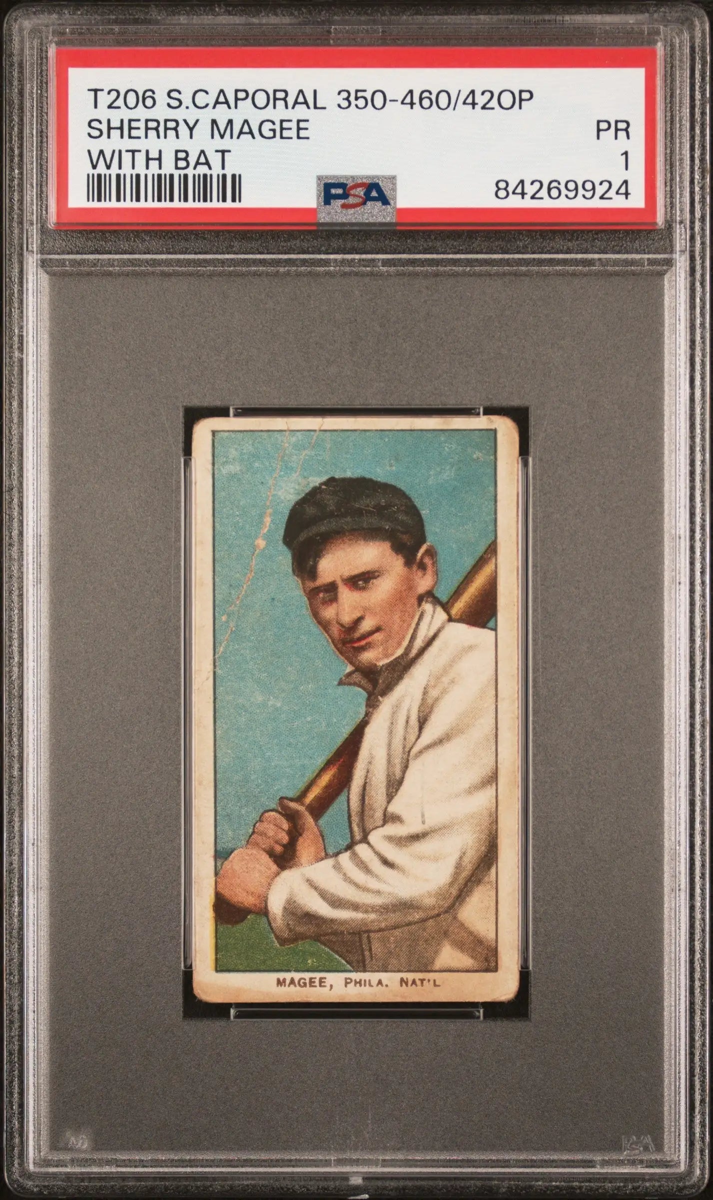 PSA-graded T205 Sherry Magee baseball card in white uniform on light blue background