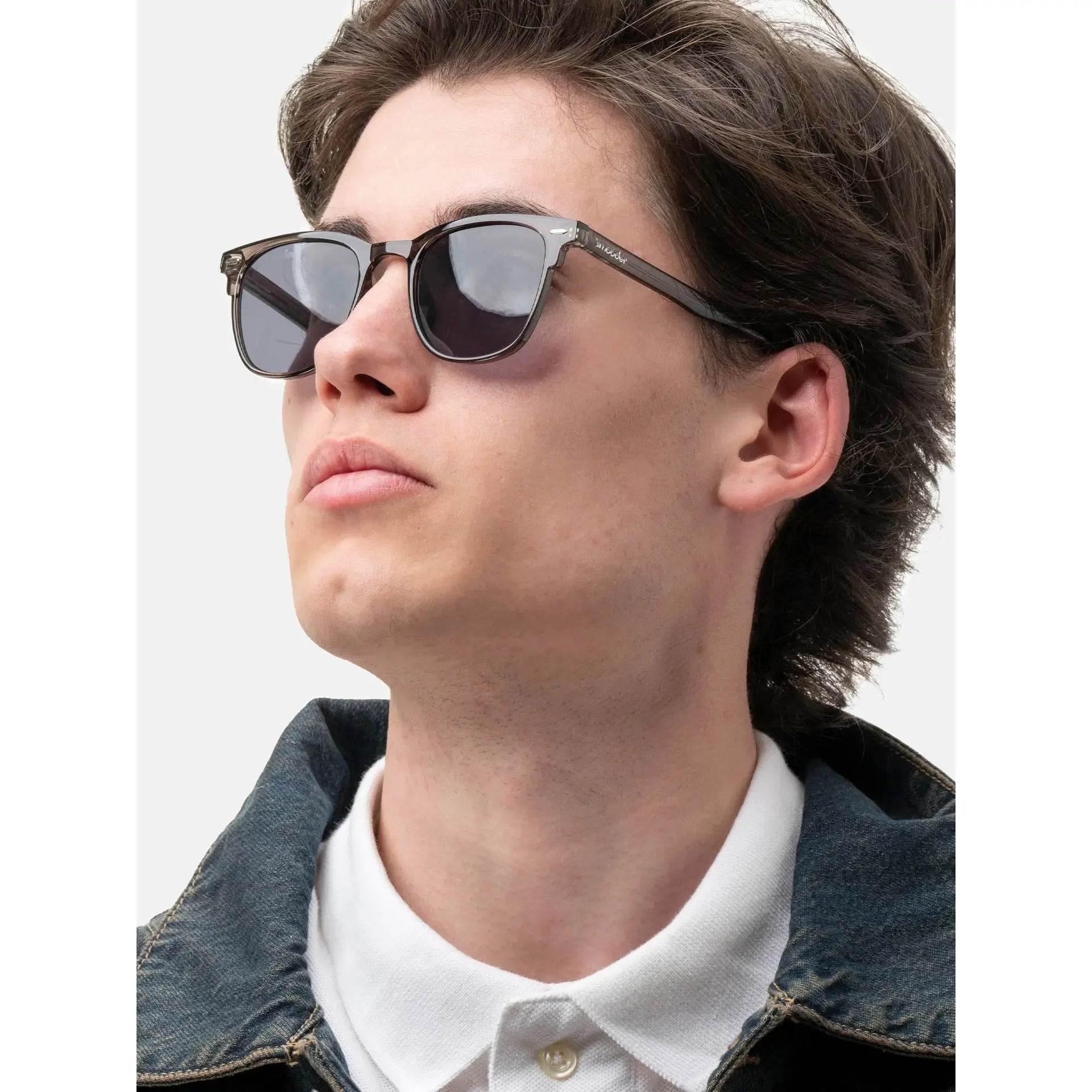 Young man wearing denim jacket and Smooder sunglasses in gentle grey Sonora_X020 style