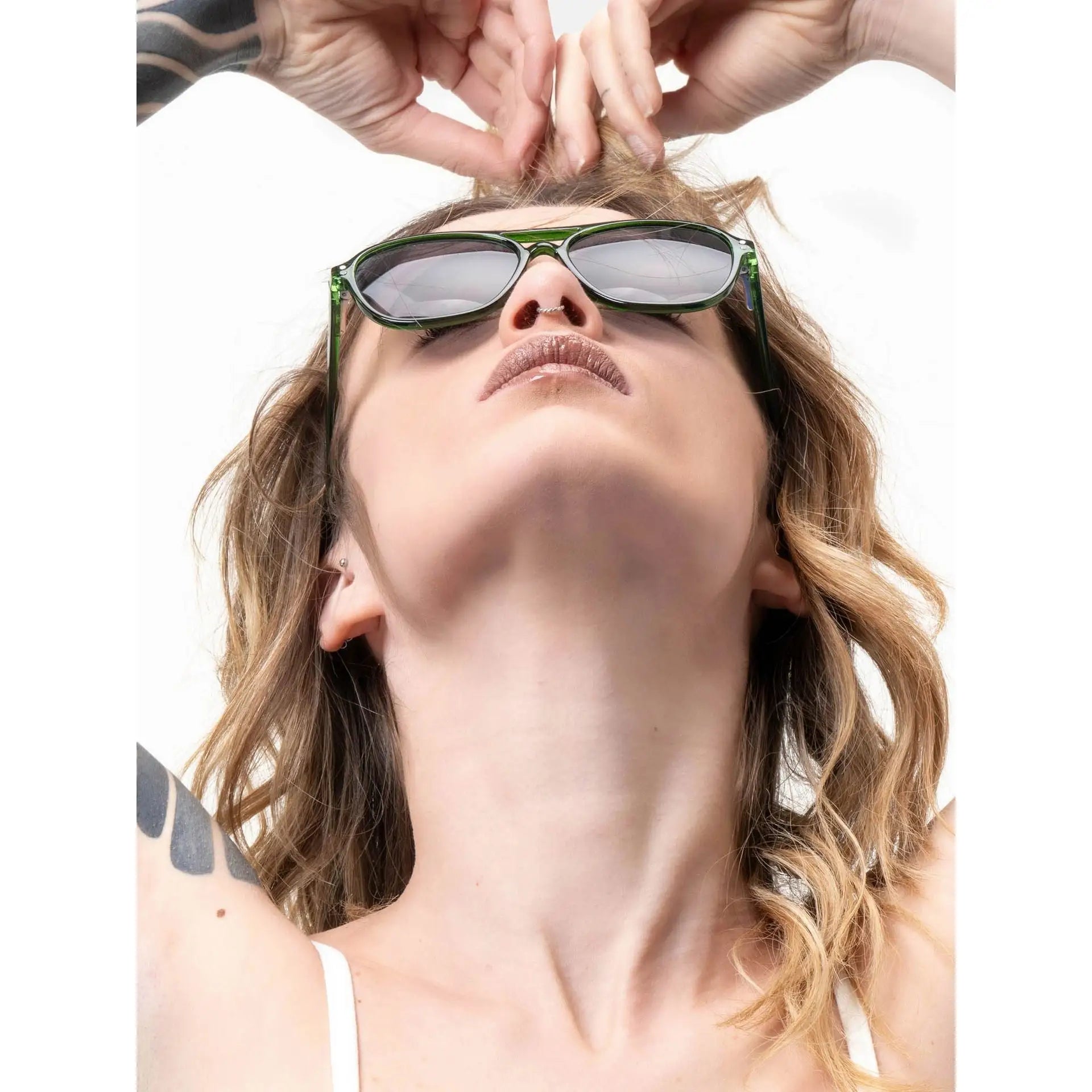 Woman with blonde hair wearing green-framed Smooder sunglasses Piper_X014
