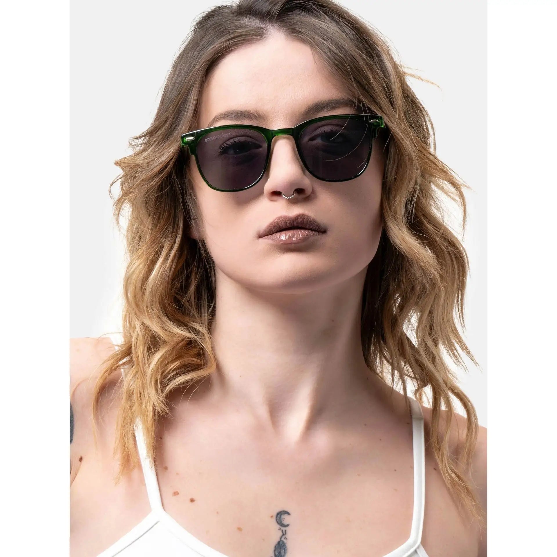 Woman with wavy blonde hair wearing Smooder Sunglasses Superior Green Sonora_X023