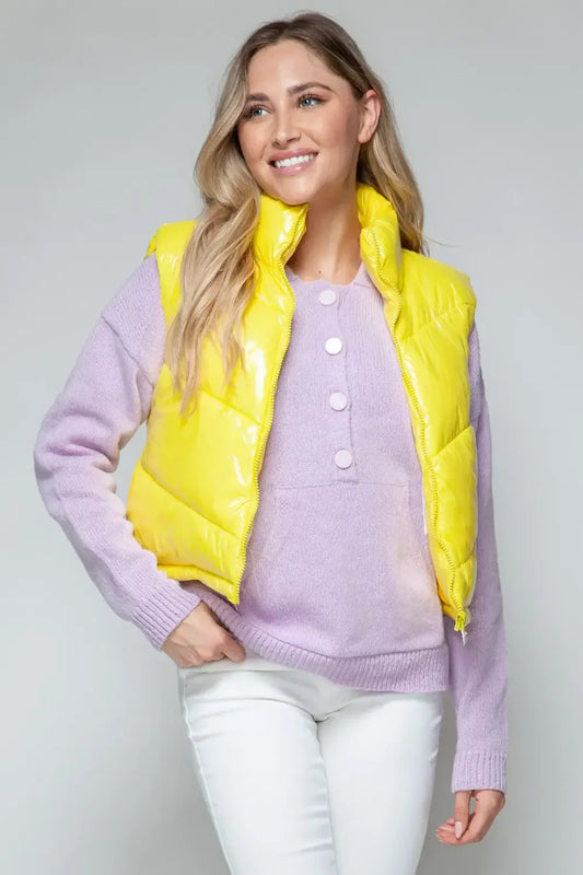Glossy yellow quilted vest over lavender turtleneck shiny quilted vest for stylish layering