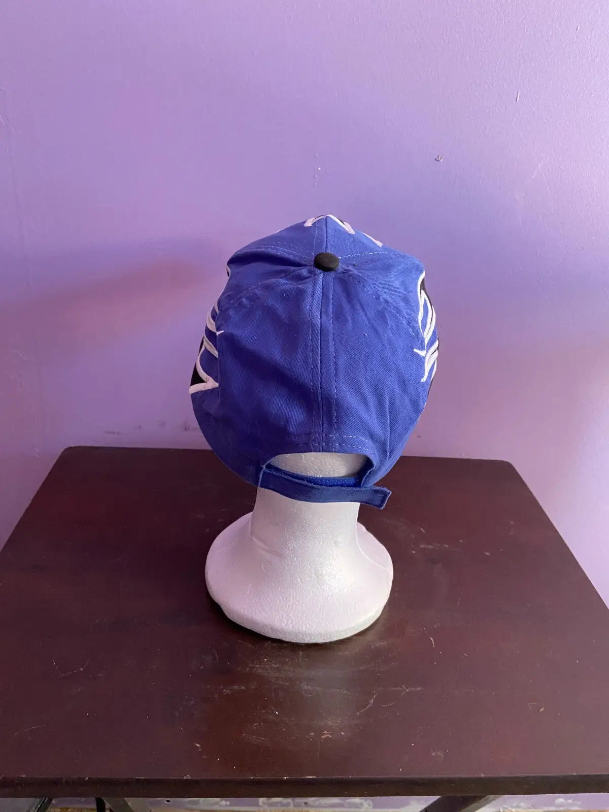 Southpoint Blue/Black Flame Racing Hat Signed by Brendan Gaughan NASCAR on display