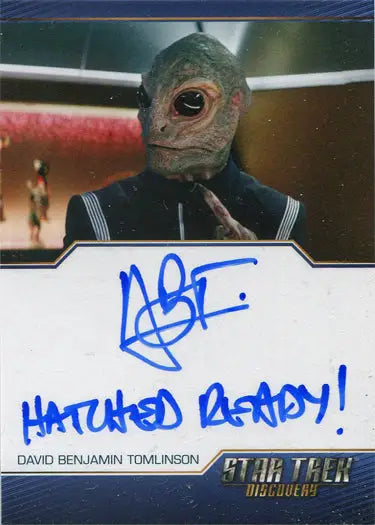 Alien creature with green scaly skin in blue uniform on Star Trek Discovery trading card