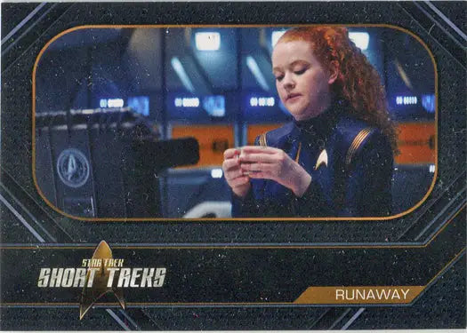 Woman with red curly hair in blue uniform using a device from Short Treks Chase Card