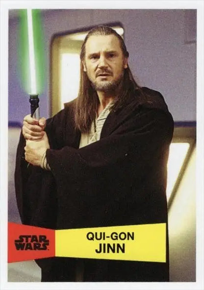 Man with long hair and green lightsaber in Star Wars-themed trading card