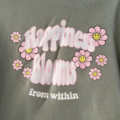 Olive green sage green pullover hoodie with pink flowers and Stella Tweed branding