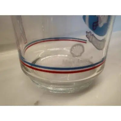 Vintage Houston Oilers glass with clear body and red and blue stripes for NFL fans
