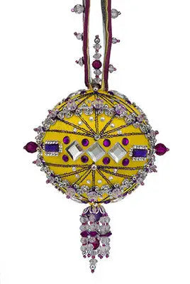 Decorative yellow ornament with purple and clear beads from The Cracker Box Chartres ornament kits