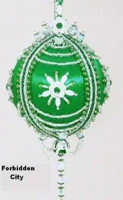 Intricately beaded green satin Christmas ornament from Cracker Box ornament kits
