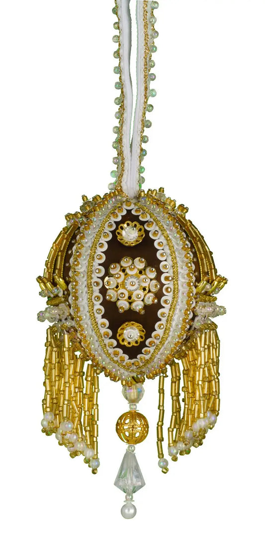 Ornate gold and white hanging Christmas ornament from the Cracker Box Baby Boobie kit