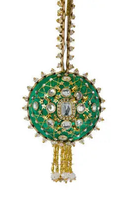 Ornate green circular ornament with gemstones and gold accents from The Cracker Box Grand Duke kit