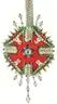 Ornate red green decorative ornament with white accents and beads from The Cracker Box Christmas Ornament Kit