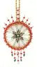 Intricate cracker box wintertime artistry Christmas ornament with starburst design and tassels