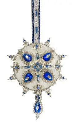 Intricately beaded white Christmas ornament with blue accents from Cracker Box Crystal Ball kit